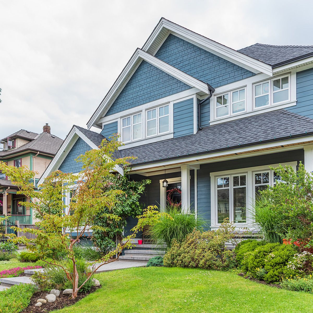 Blue house with green landscaping