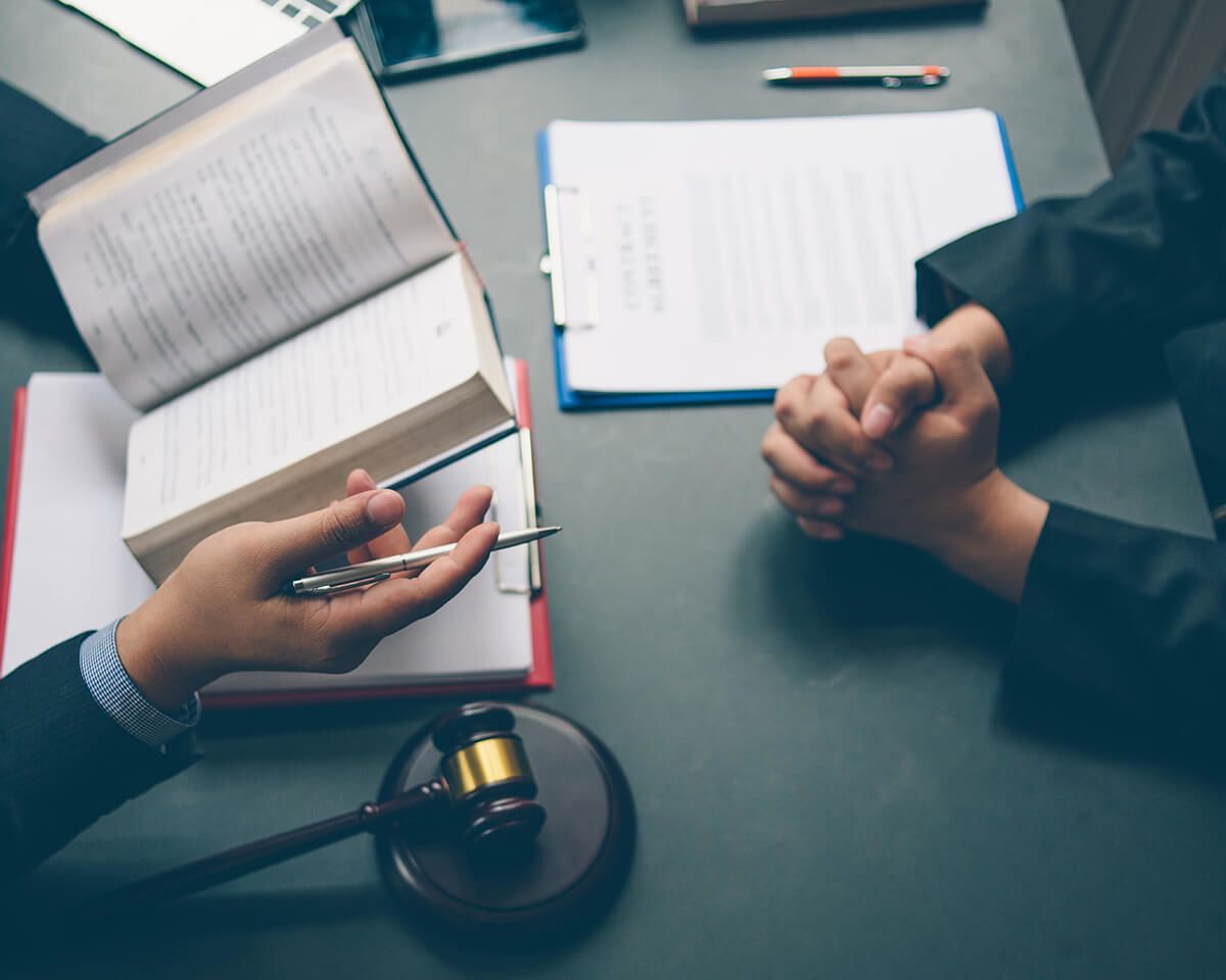 A lawyer discussing terms with a client
