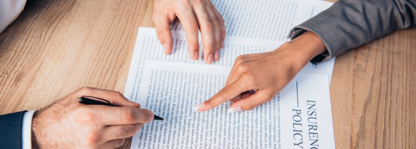 Woman pointing out a clause in an insurance policy