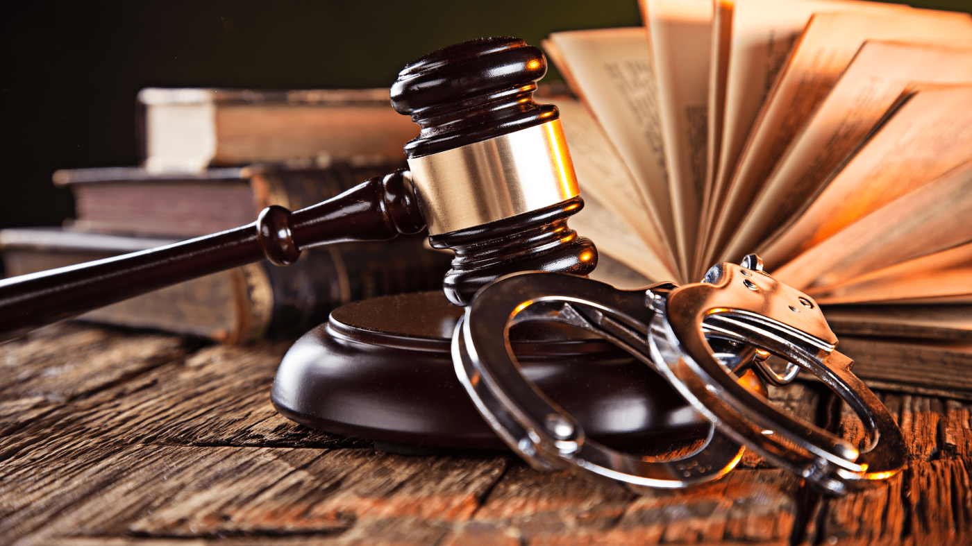 Wooden gavel and books on wooden table