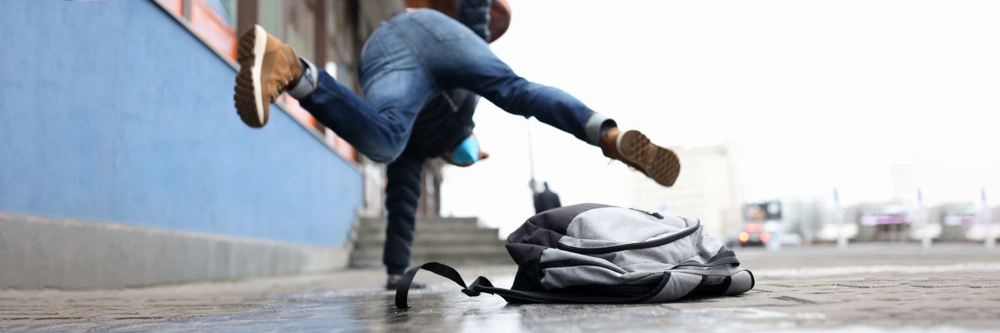Man slipping on icy sidewalk