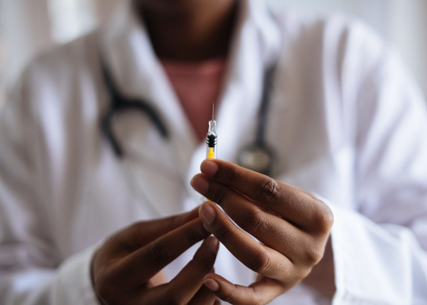 doctor holding a needle