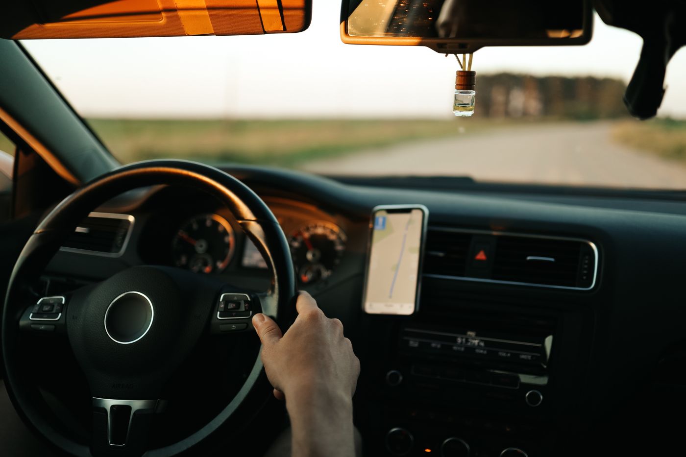 man driving and using GPS