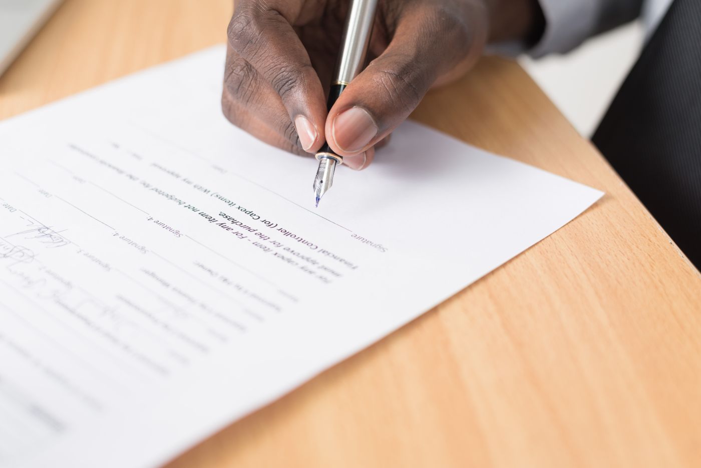person filling out a document