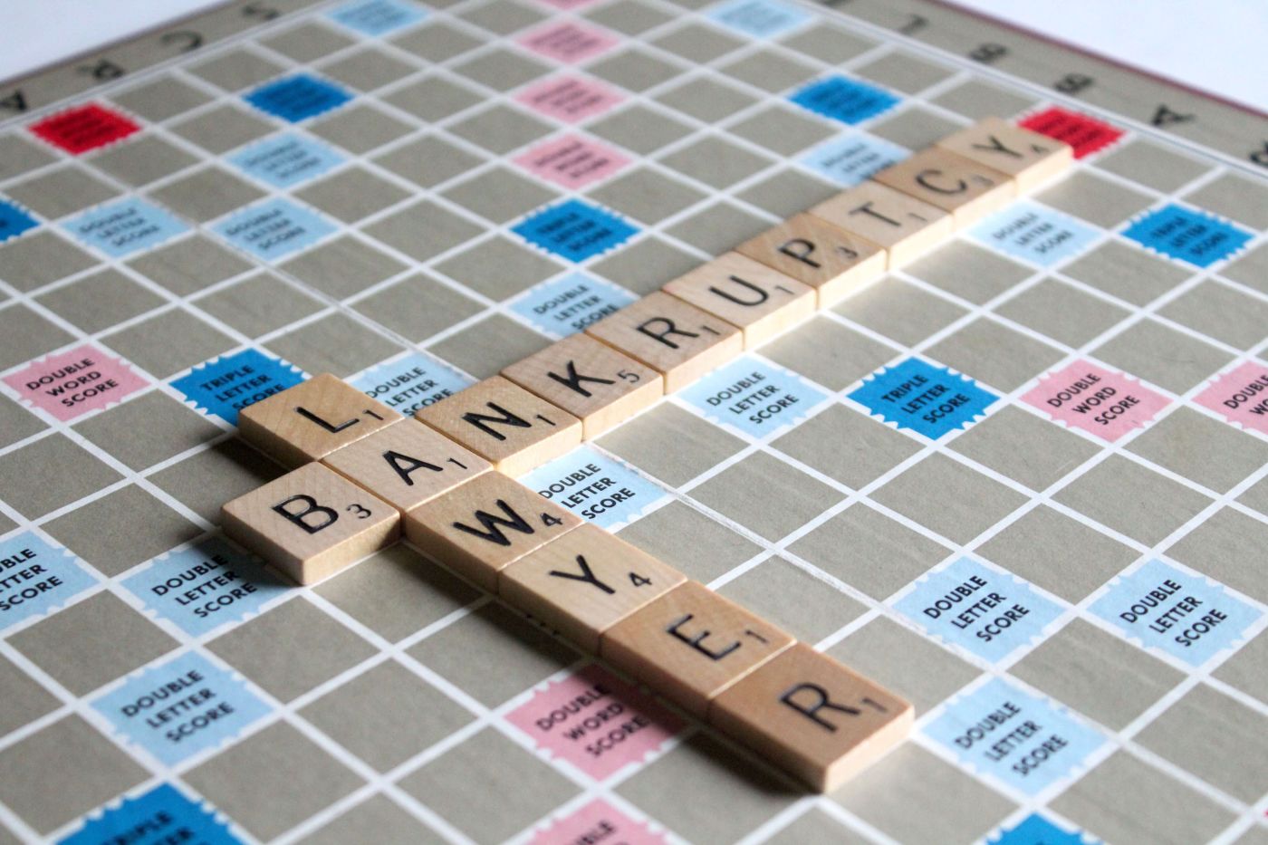 The Word Bankruptcy and the Word Attorney Spelled Out in Scrabble Tiles.jpg
