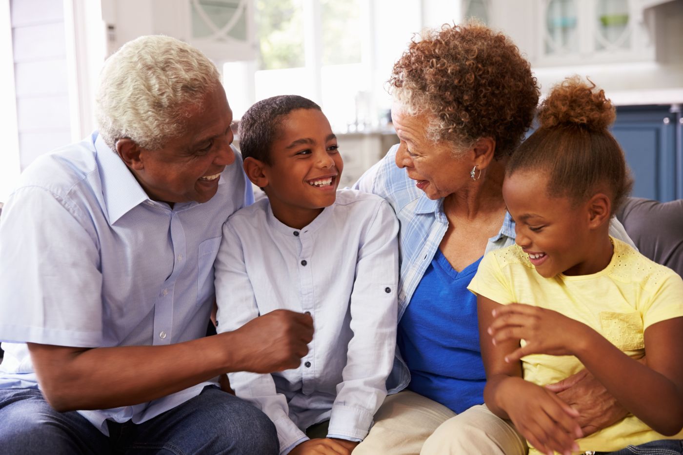 Elderly couple with two young children