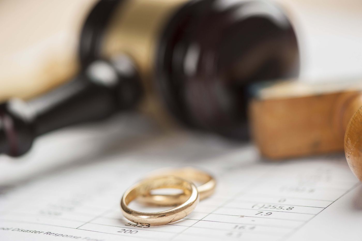 Two gold rings next to gavel