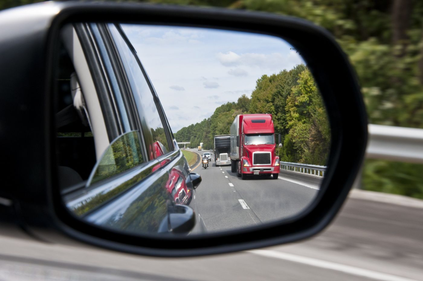 Red Truck Behind | Trucking Accident Attorney