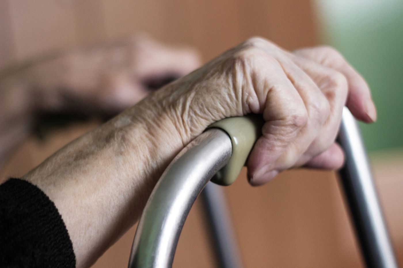 Elderly Man In Crutches