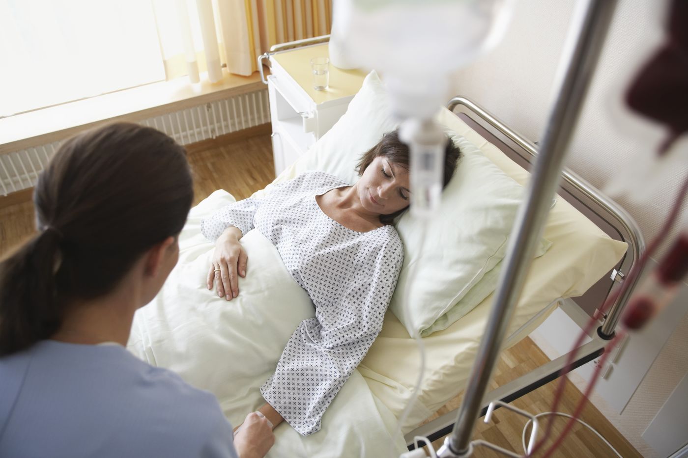 Woman Lying in a Hospital Bed