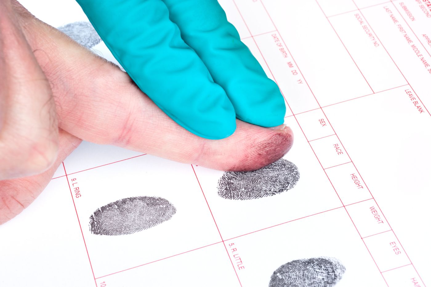 Hand getting fingerprinted