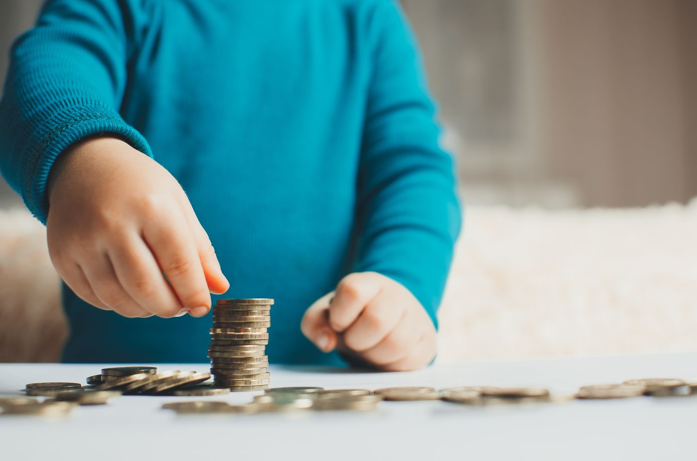 Child counting coins