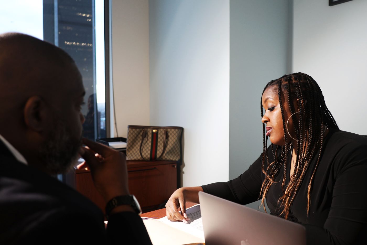 Krystal Clervaud looking at papers