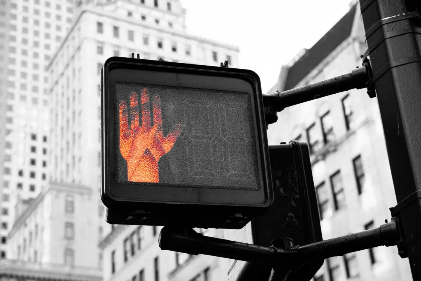 Street light with a hand stop signal