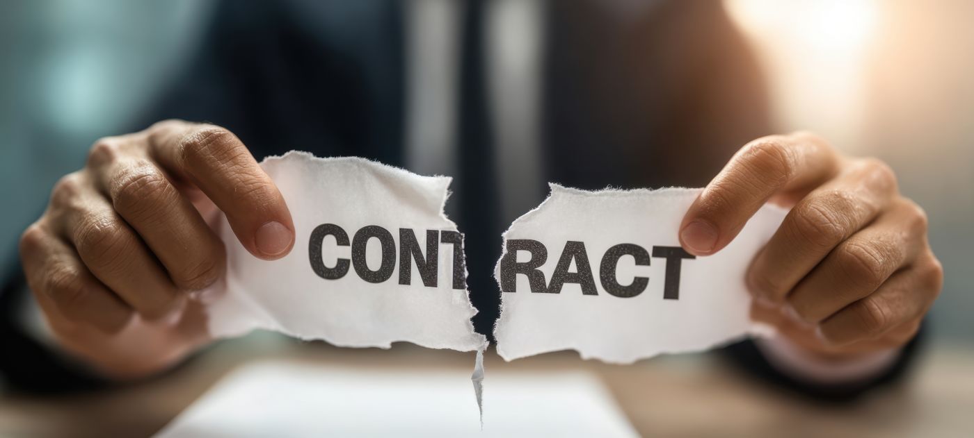 Businessman tearing paper with term contract