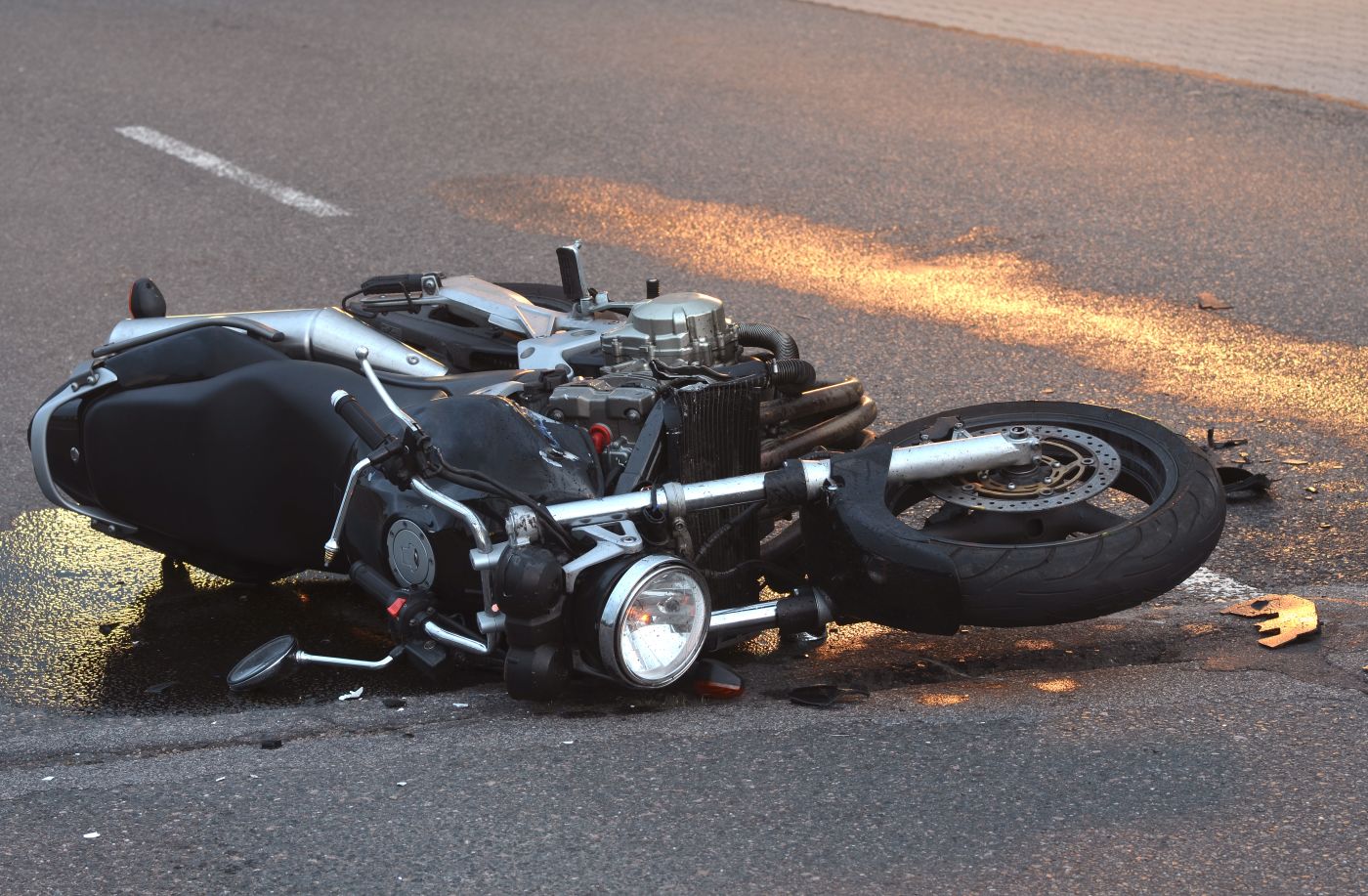 Crashed motorcycle in road