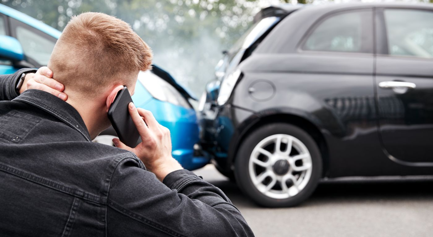Injured driver calling for help after car crash