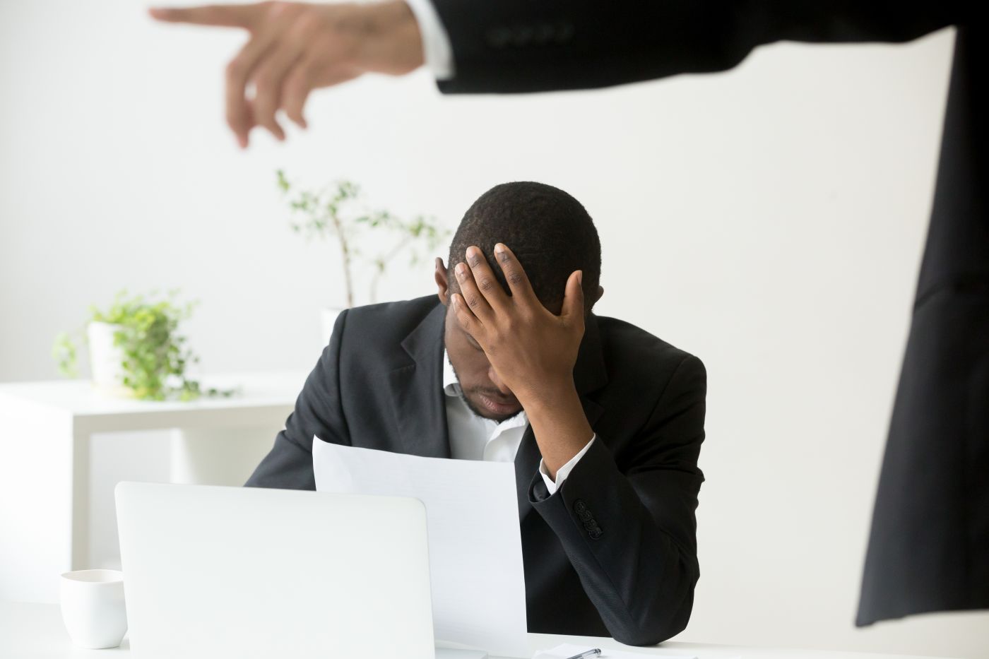 Sad man receiving termination letter