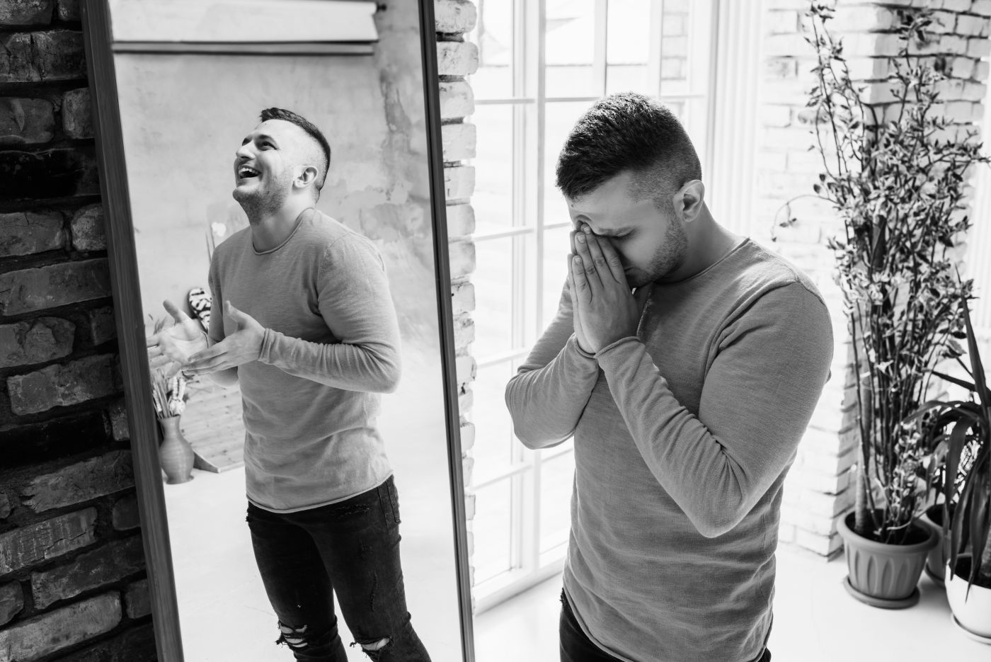Man with bipolar disorder at the mirror