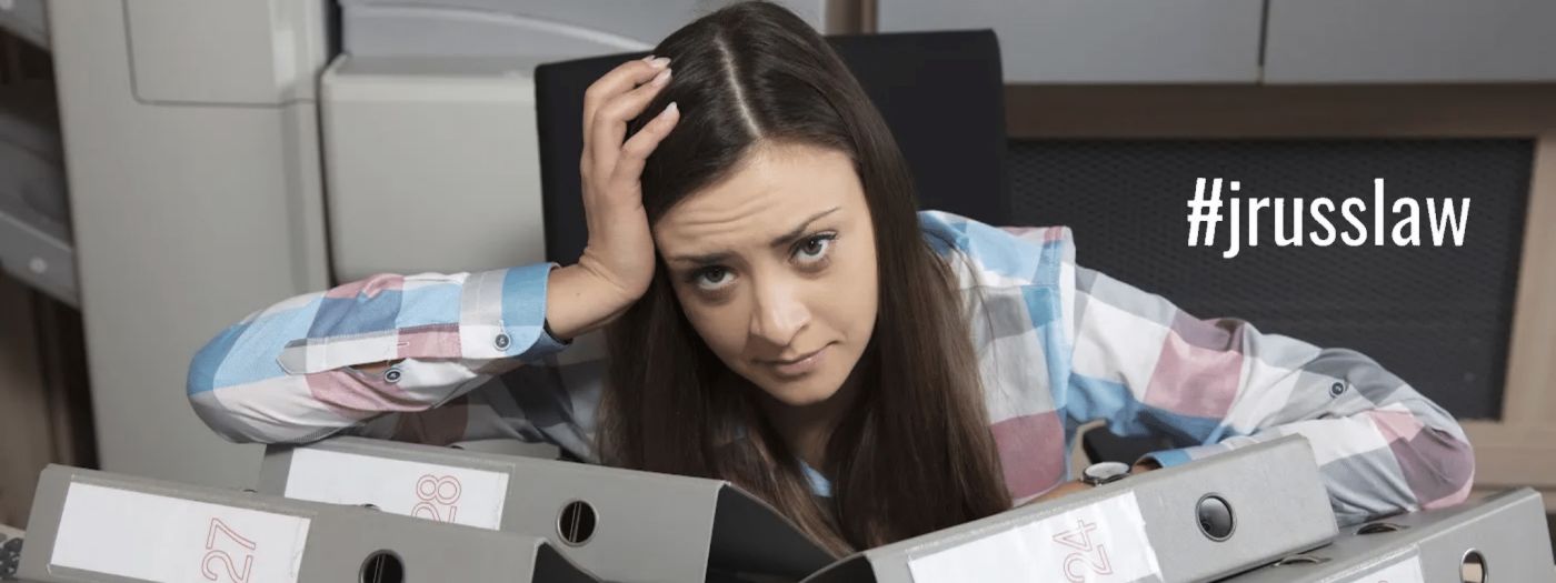 A woman frustrated with files.