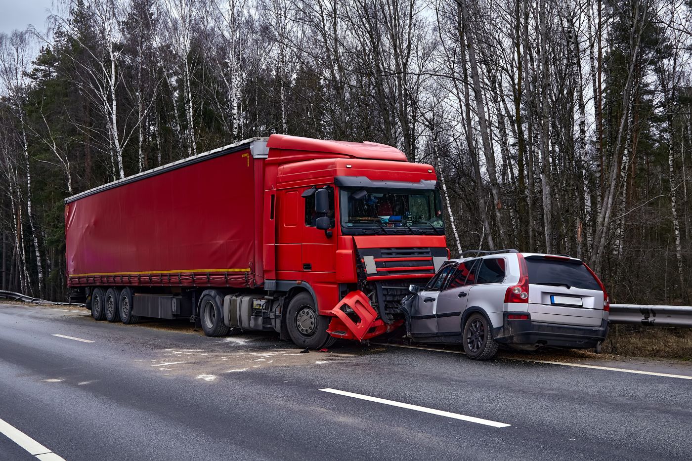 Collision between car and truck on road