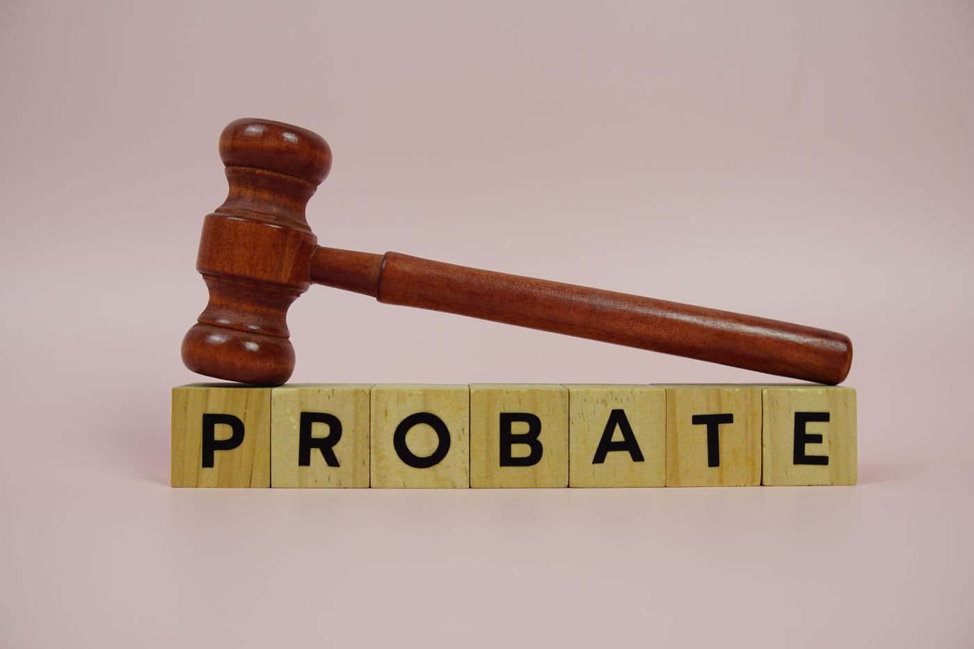 Gavel on top of word Probate, made up of wooden blocks