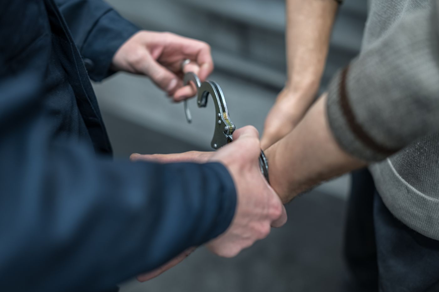 Police handcuffing male suspect