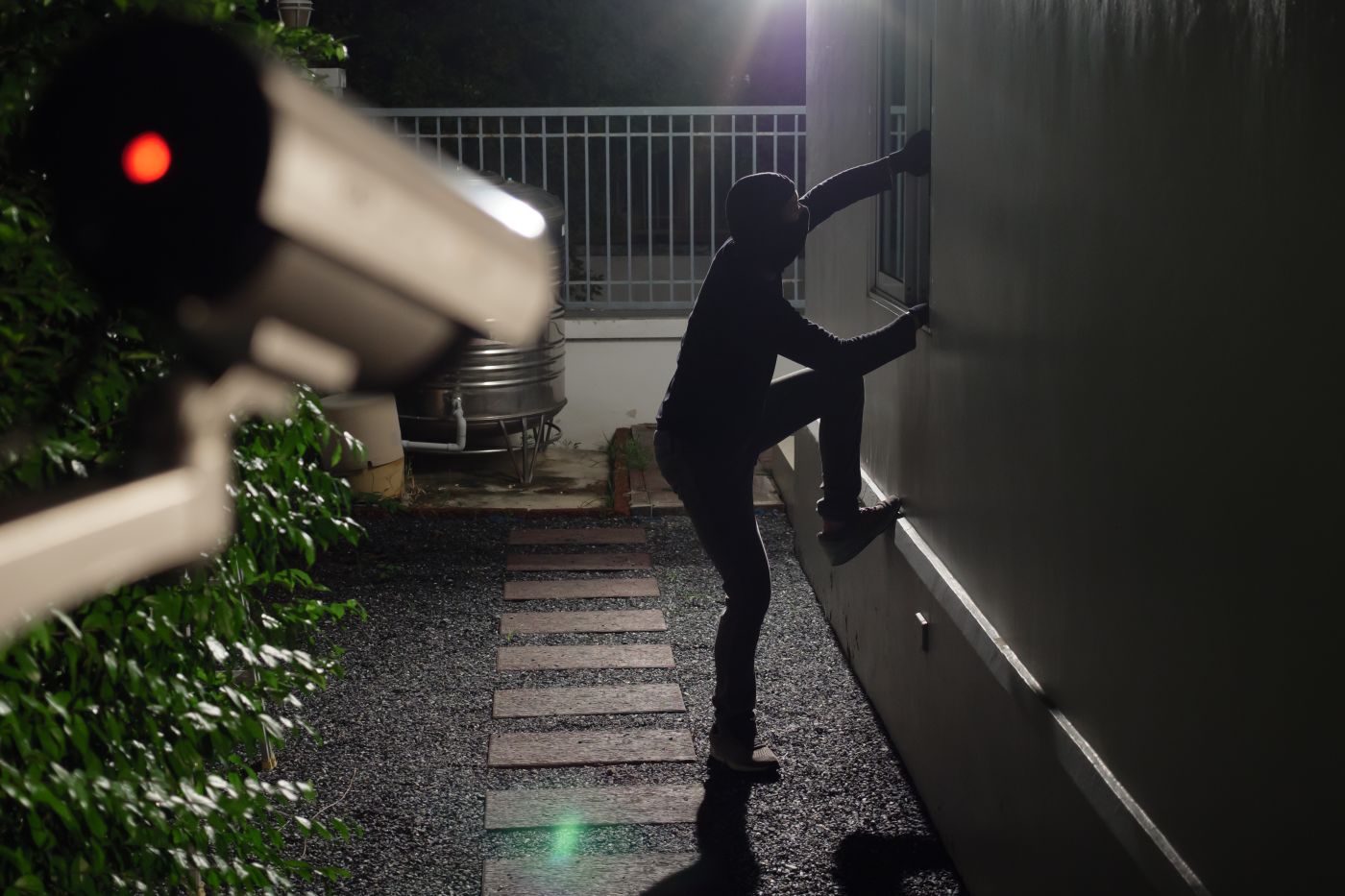 CCTV Surveillance camera capturing thief during breaking into house