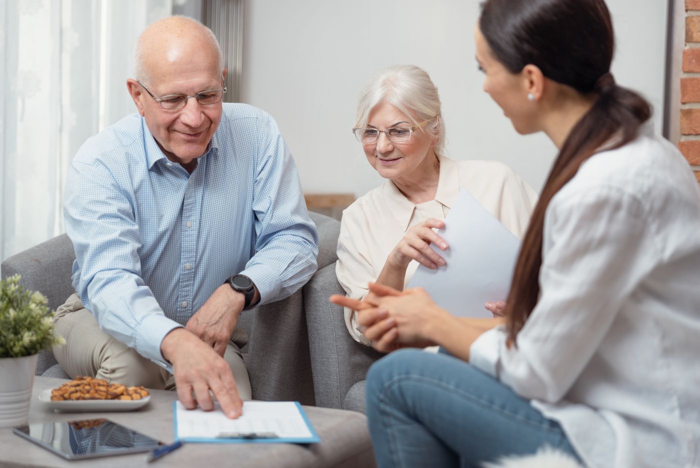 Senior couples discussing their estate plan with professional