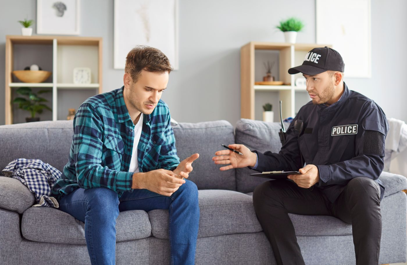 Police officer talking to a male witness