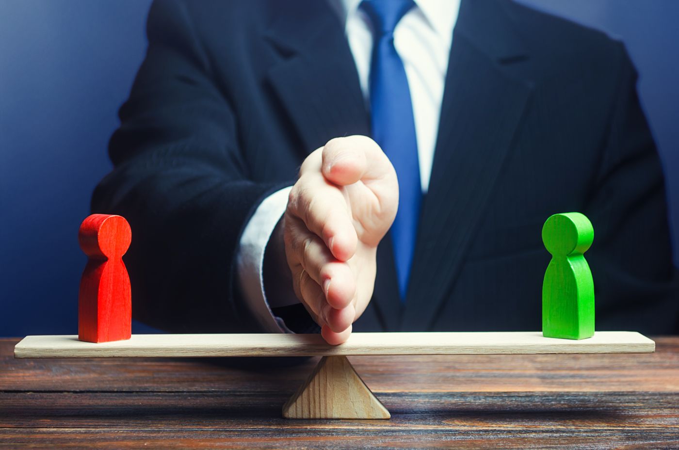 Mediator separating two sides of a business dispute during mediation