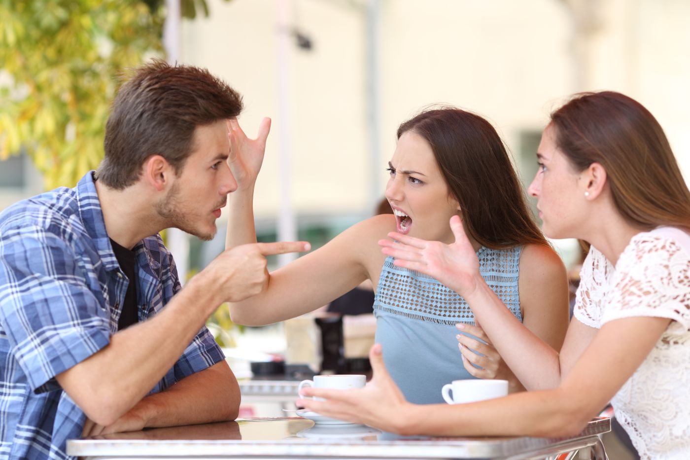 Siblings arguing outdoors