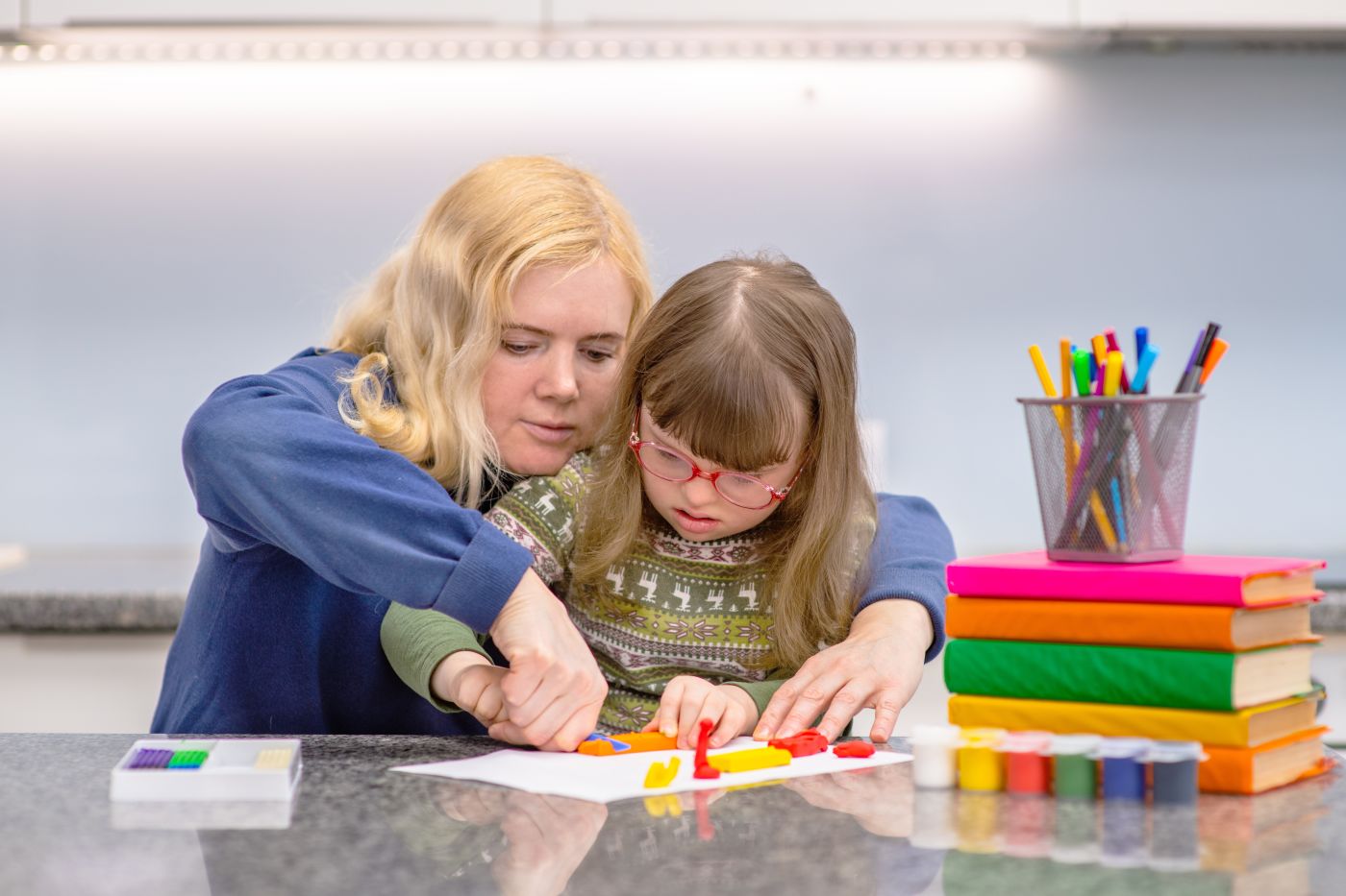 Special need child drawing at classroom