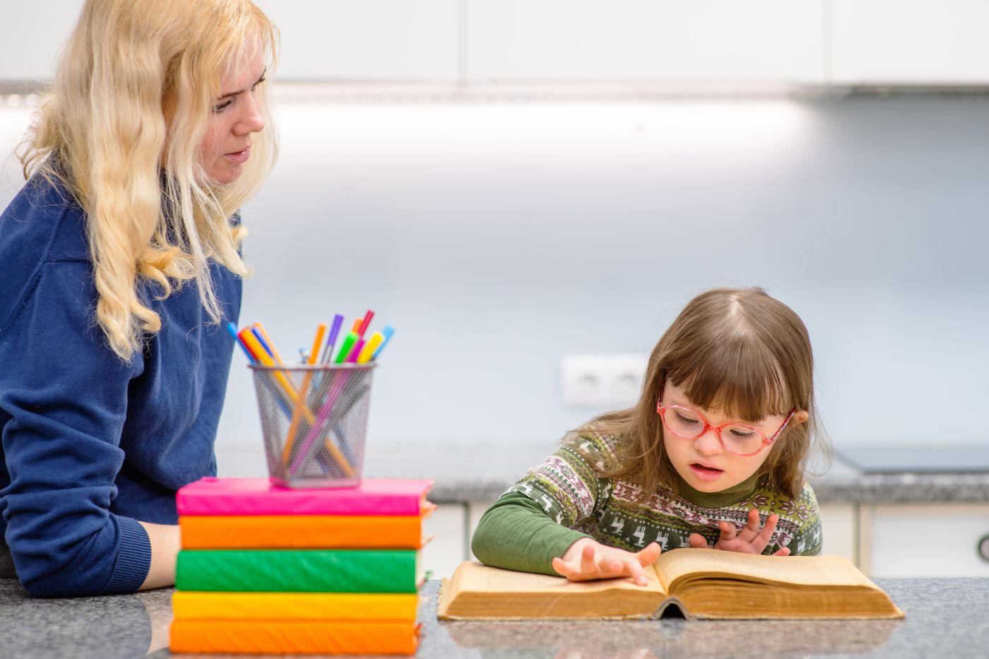 Special need child learning with her teacher