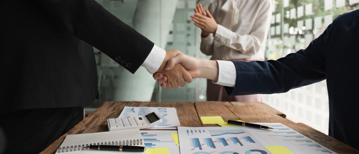 Businessmen shaking hand after successful deal