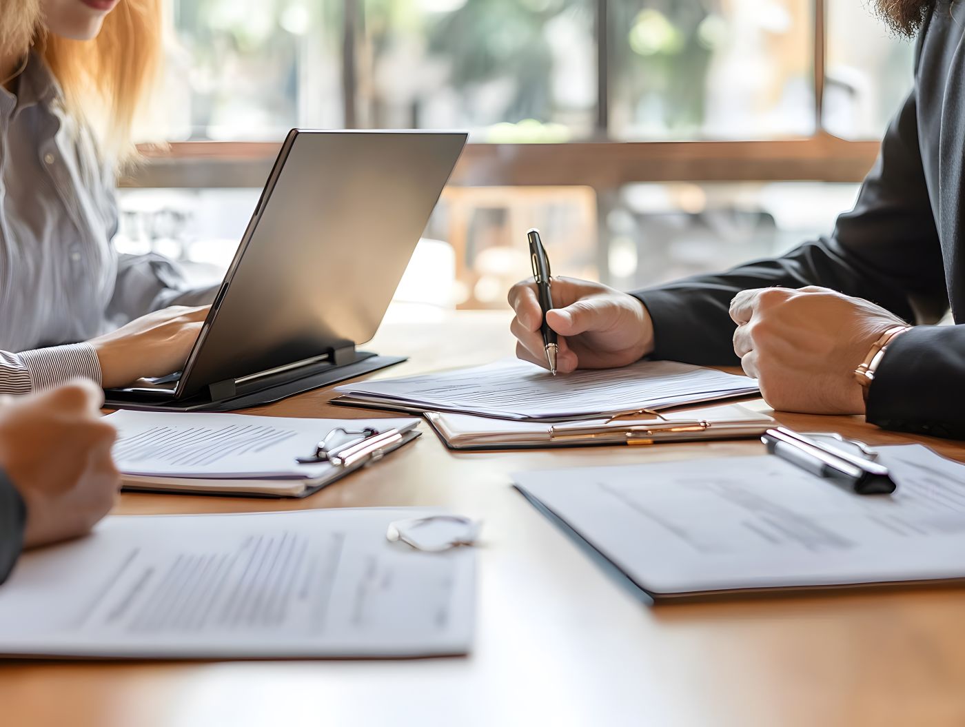 Businessmen negotiating contract terms