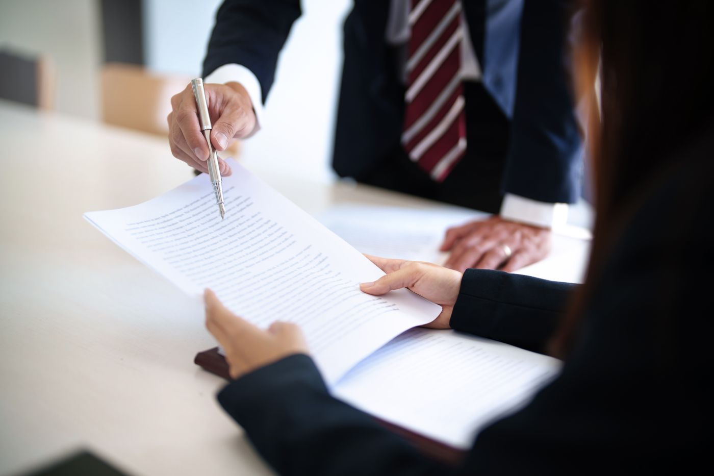 Client discussing contract terms with lawyer