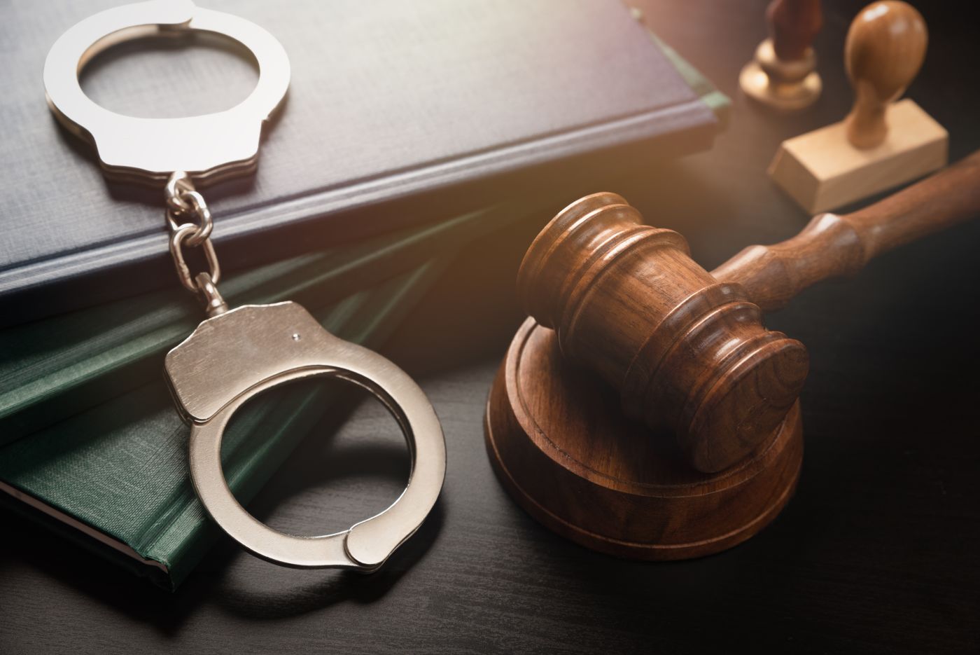 Gavel and Handcuff on table