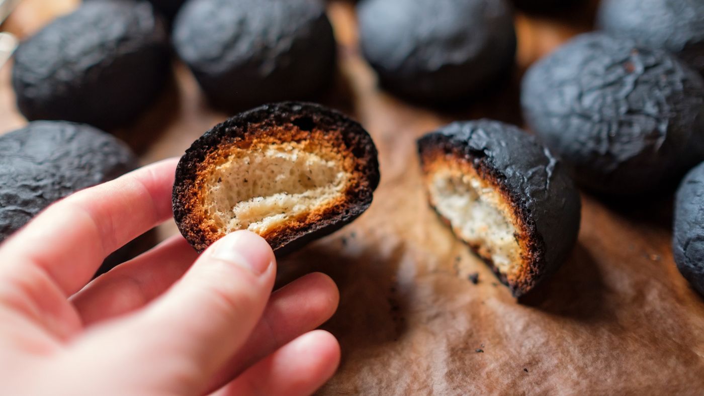 A baker handling burnt bread