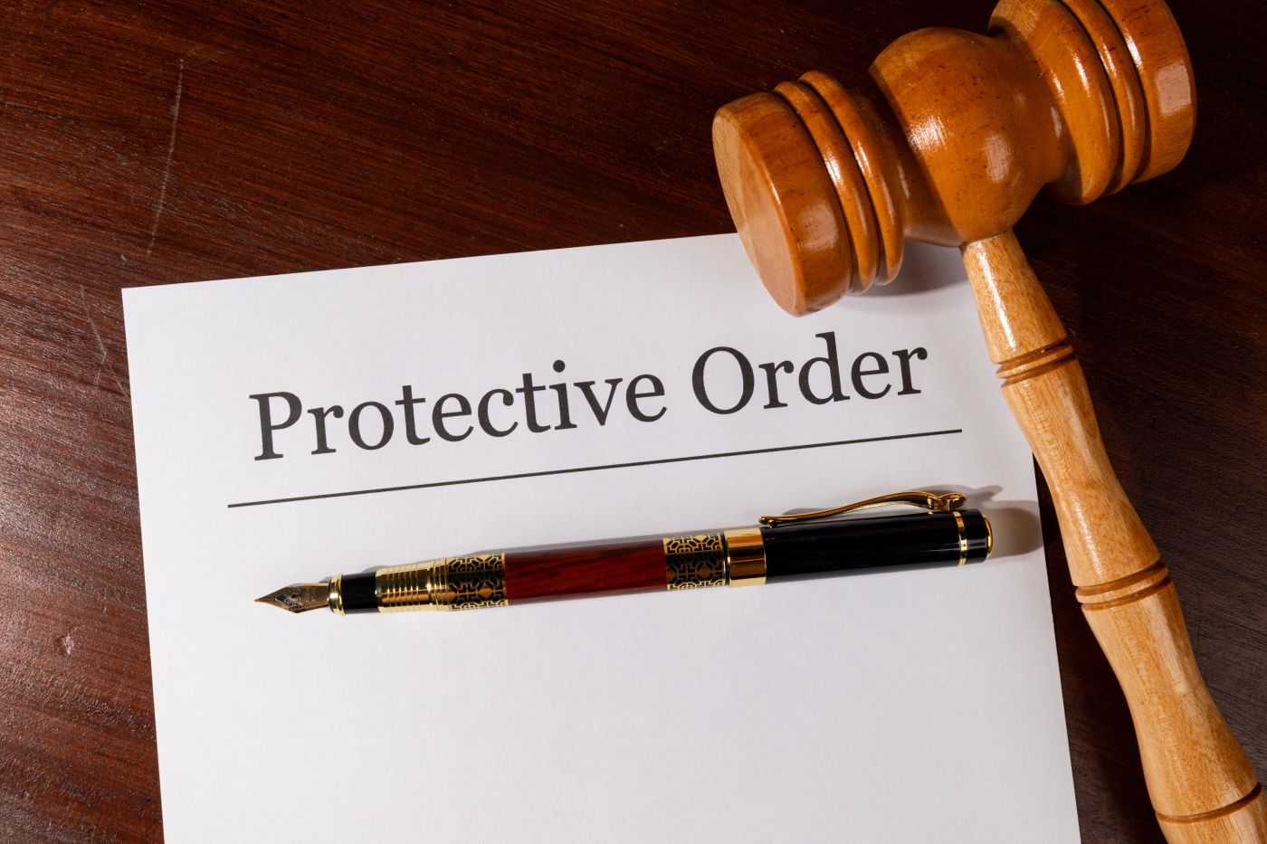 Protective Order file and gavel in table