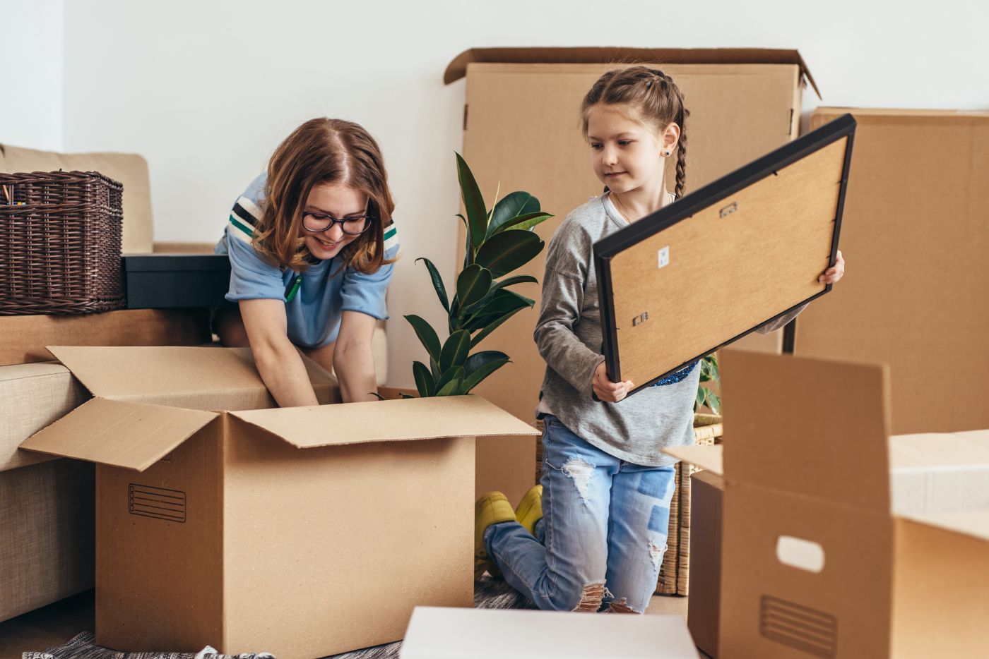 Mother and Daughter unpacking at new home