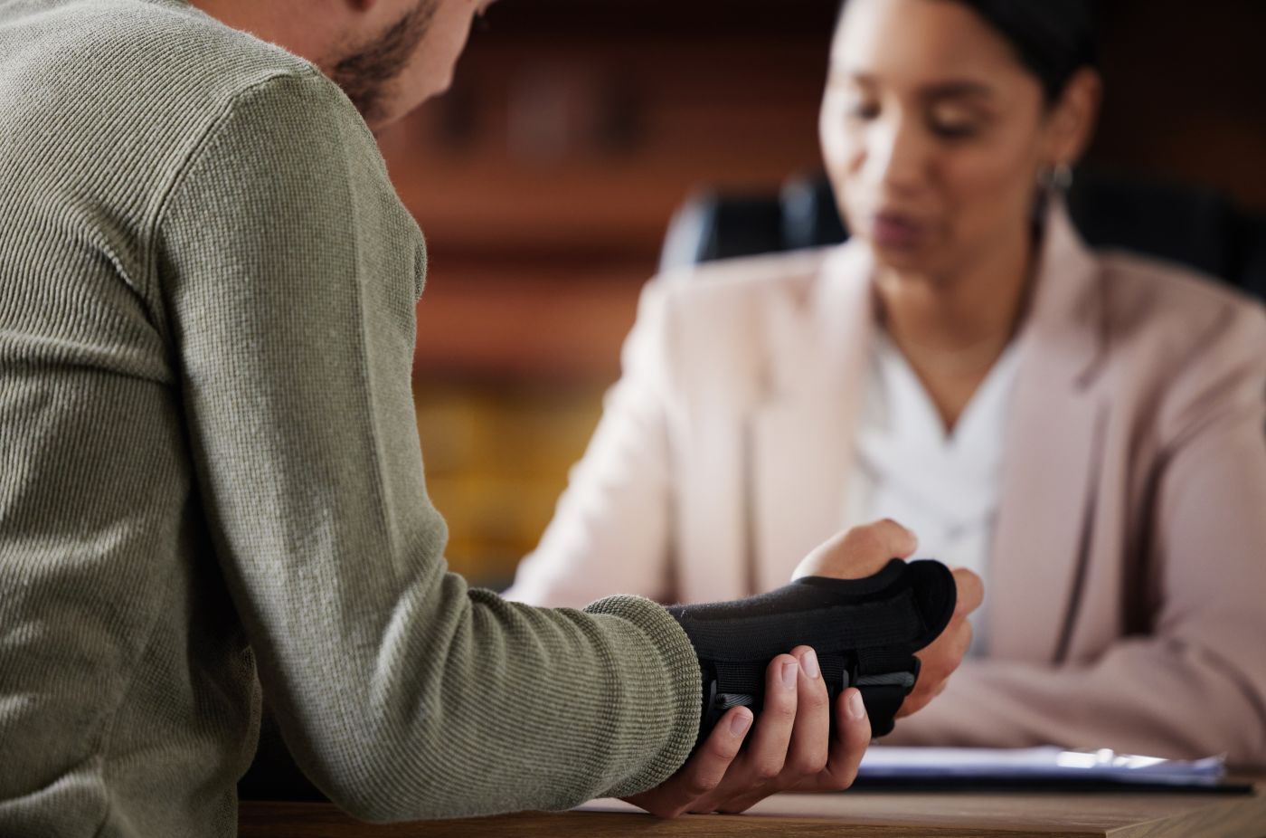 Injured worker consulting with attorney