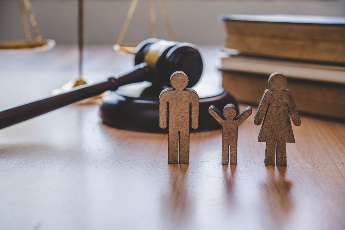 Family figures and gavel in table