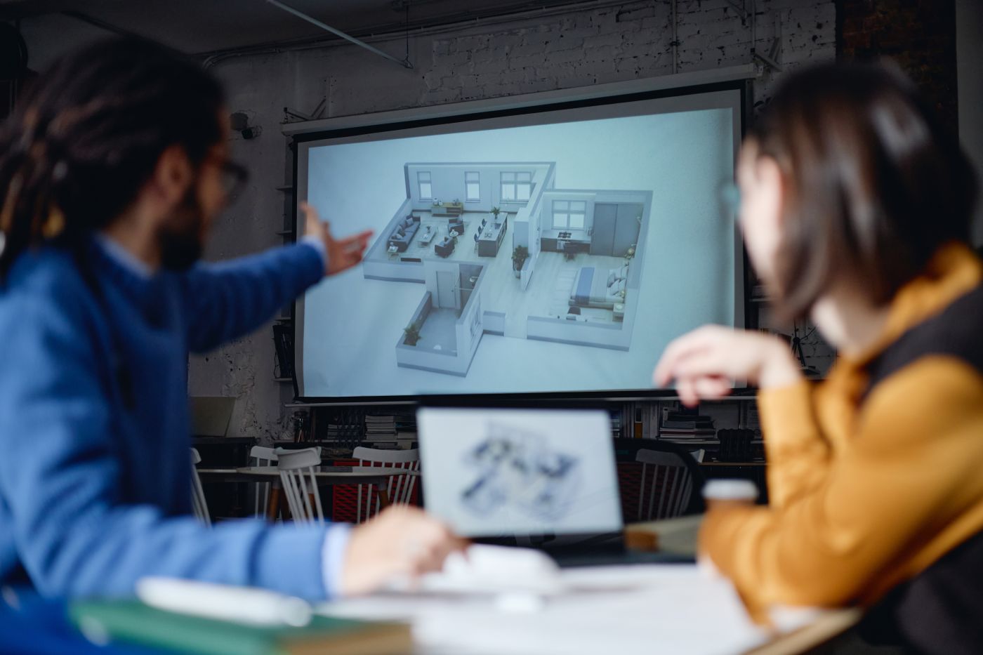 Architects discussing on a floor plan
