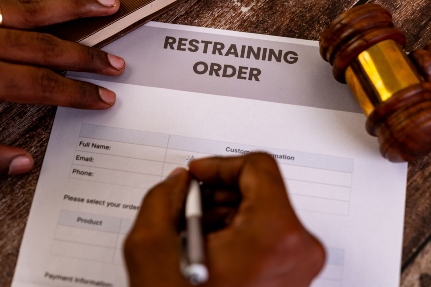 Man filing a Restraining Order Form