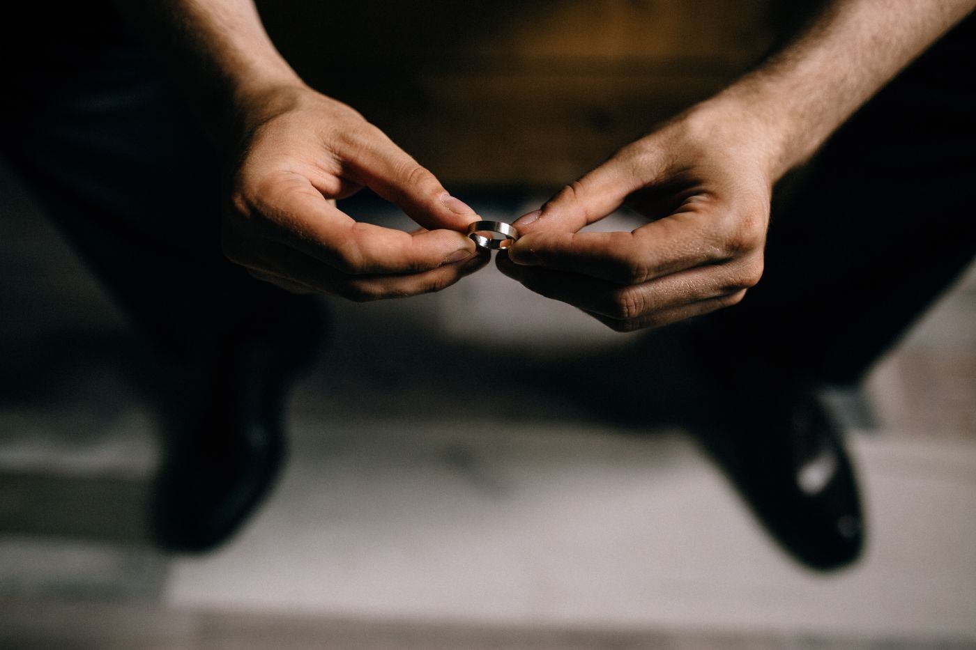 Man holding wedding ring in hand
