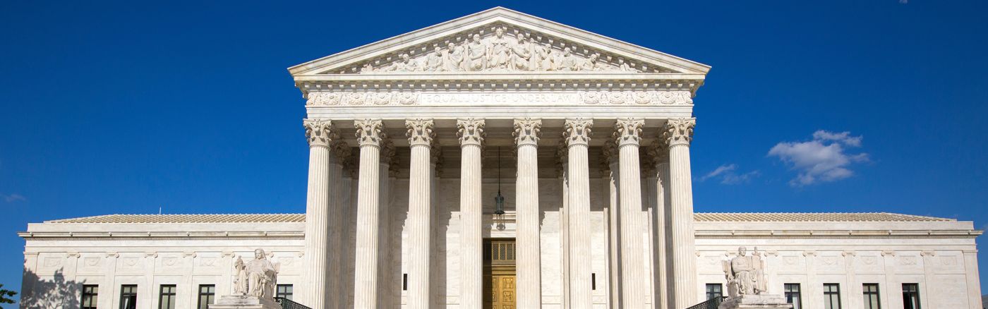 Supreme courthouse in Washington. Blue sky behind.