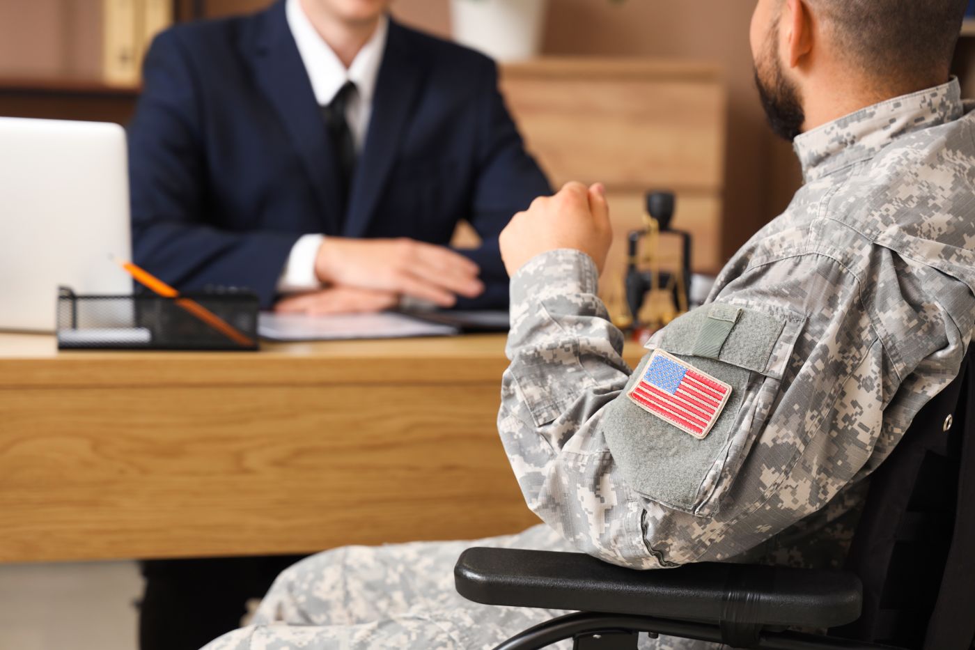 Military man meeting with attorney in his office