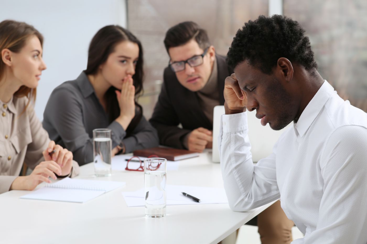 African American man suffering from racial discrimination at work