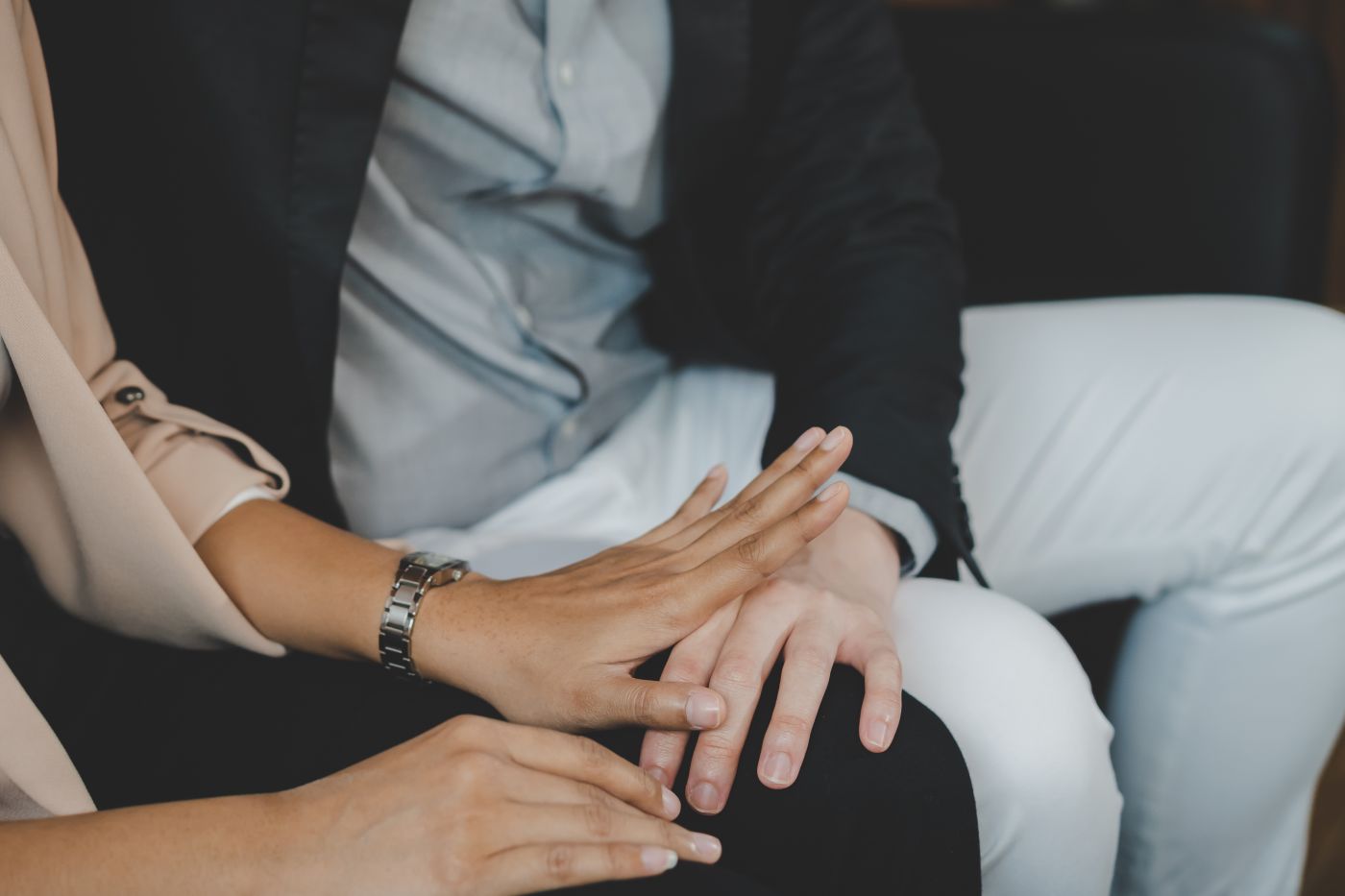 Man touching his female colleague inappropriately in office